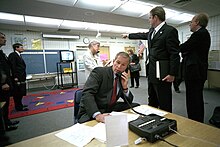 President George W. Bush is briefed in Sarasota, Florida, where he learned of the attacks unfolding while he was visiting an elementary school. President George W. Bush Receives Information Regarding Terrorist Attacks.jpg