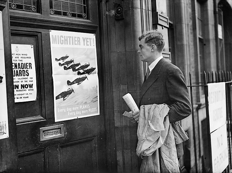 File:Prospective RAF recruit Michael Suthers arrives at Euston Combined Recruits Centre and is attracted by a poster on the door showing a formation of Hawker Hurricane fighters in flight, November 1940. CH1645.jpg