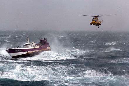 A Royal Air Force search and rescue Sea King helicopter comes to the aid of the French fishing vessel Alf during a storm in the Irish Sea.