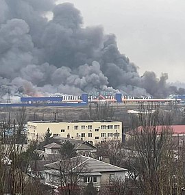 Burning buildings during the Siege of Mariupol, 2022 Russian bombing of Mariupol.jpg