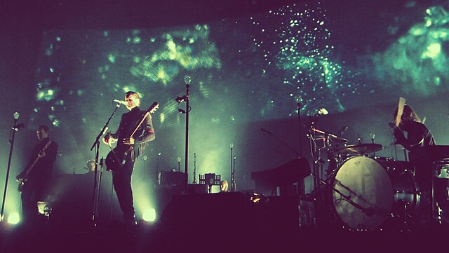 Sigur Rós performing in 2013. From left to right: Georg, Jónsi and Orri