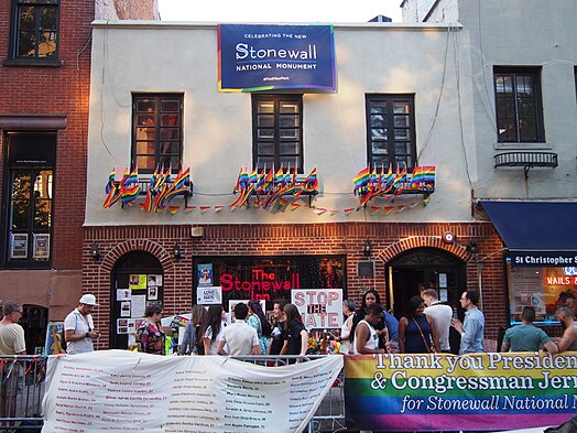 Greenwich Village, a gay neighborhood in Manhattan, is home to the Stonewall Inn, shown here adorned with rainbow pride flags.[1][2][3]