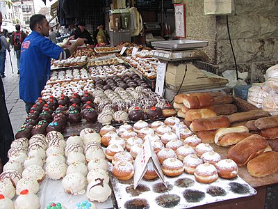 Powdered and iced sufganiyot for sale in Jerusalem before Hanukkah 2014