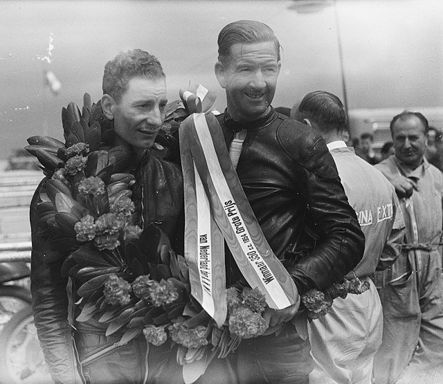 Fergus Anderson (right) successfully defended his 350cc World Championship title in 1954.