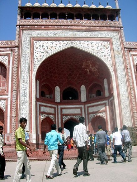 Gate to the Taj Mahal Complex showing intricate work and Quranic passages in Arabic