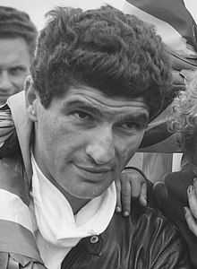 Tarquinio Provini (pictured in 1959), the 1958 250cc World Champion. Tarquinio Provini won de race in de 250cc klasse Met vrouw en zoontje, Bestanddeelnr 910-4762 (cropped).jpg