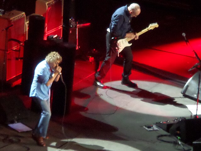 The Who performing "Baba O'Riley" live at Manchester Arena in 2014. Roger Daltrey, left, is playing harmonica during the song's climactic outro. Pete 