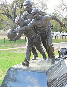 Statue of cricketer and Australian rules football pioneer Tom Wills umpiring an 1858 football match Tom wills statue.jpg