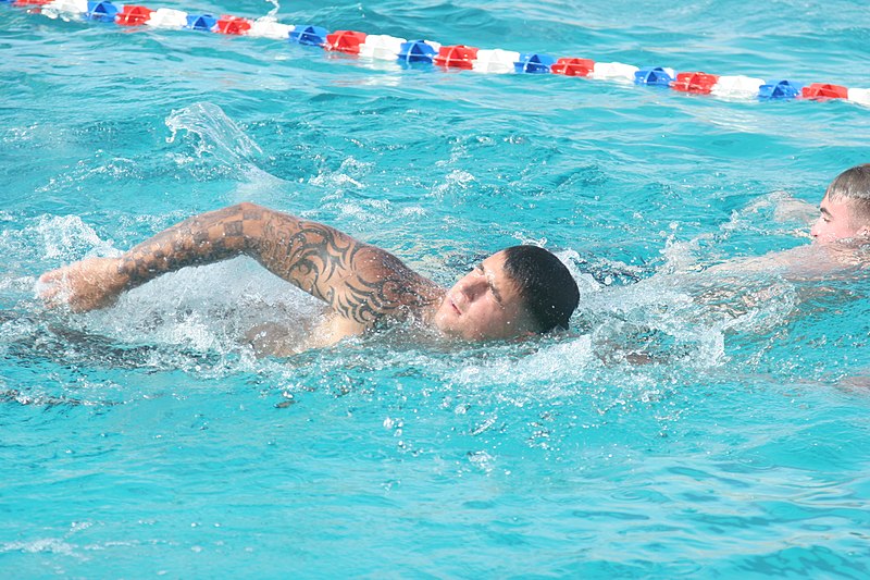 File:U.S. Marine Corps Lance Cpl. Michael Ludvik, with India Company, 3rd Battalion, 7th Marine Regiment, swims the front crawl stroke during aquatic training in the base swimming pool at Marine Corps Air Ground 090519-M-GC698-026.jpg