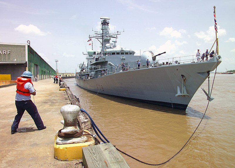 File:US Navy 070718-N-0857S-003 Electrician's Mate 2nd Class Randy Norris, assigned to Naval Support Activity New Orleans Boat House, pulls in the bowline for British Royal Navy frigate HMS Portland (F 79).jpg