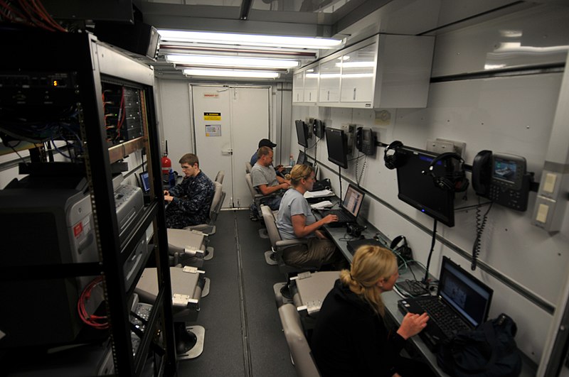 File:US Navy 100126-N-1831S-008 Media members transmit video, photos, and news stories of the relief efforts in Haiti from a media trailer aboard the multi-purpose amphibious assault ship USS Bataan (LHD 5).jpg