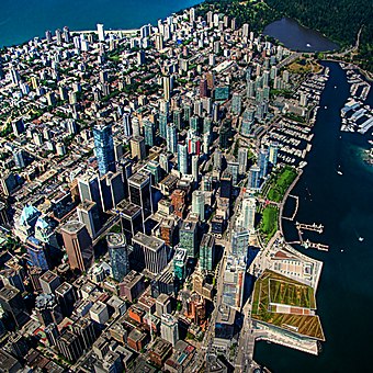 Aerial view of Downtown Vancouver. Urban development in Vancouver is characterized by a large residential population living in the city centre with mixed-use developments.