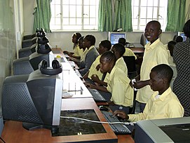 Zambian kids learning how to use computers.jpg