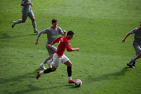 Ronaldo in 2009 with Manchester United playing in a Premier League game against Liverpool