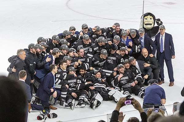 Friars pose after winning the NCAA Hockey East Regional at the Dunkin’ Donuts Center, March 31, 2019.