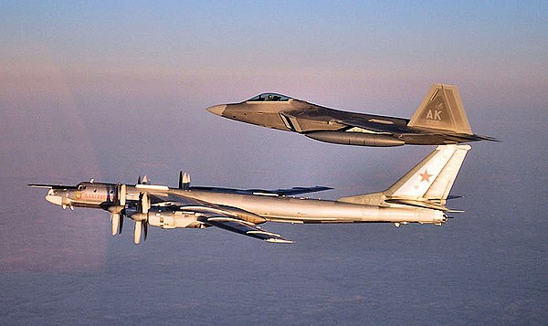 A 90th Fighter Squadron F-22 Raptor escorts a Russian Air Force Tu-95 Bear bomber near Nunivak Island