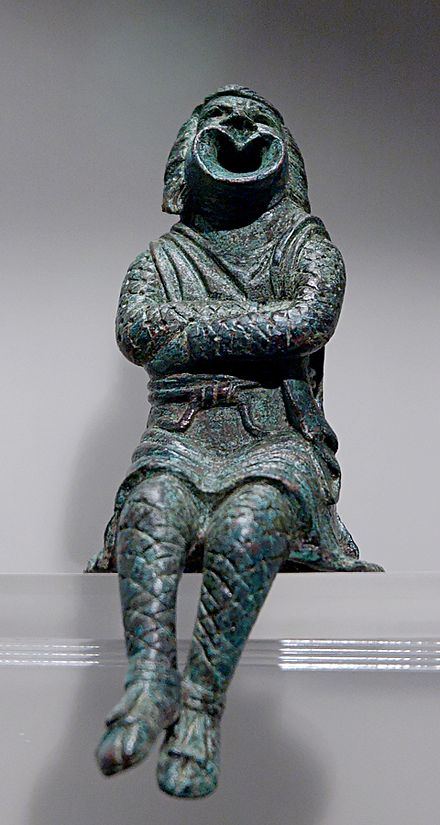 Actor playing a slave and wearing a comic mask. Bronze statuette, early 3rd century AD.