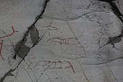 English: Rock art in the world heritage area in Alta, Norway. This is from the area Bergbukten 4b, a group of 195 figures. 22-24 m above sea level, and 6000-7000 years old.