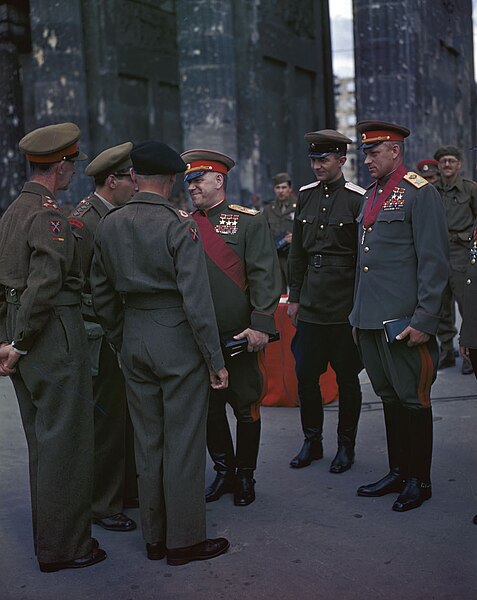 Marshal Georgy Zhukov (center) wearing three Hero of the Soviet Union medals and Marshal Konstantin Rokossovsky (right) wearing two (1945)
