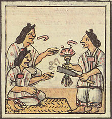 Aztec women are handed flowers and smoking tubes before eating at a banquet, Florentine Codex, 1500. Aztec feast 1.jpg