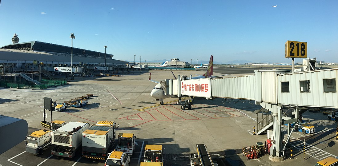 A Hainan Air Boeing 737 (foreground) at gate along with China Eastern and Xiamen Airlines aircraft parked at Terminal 2