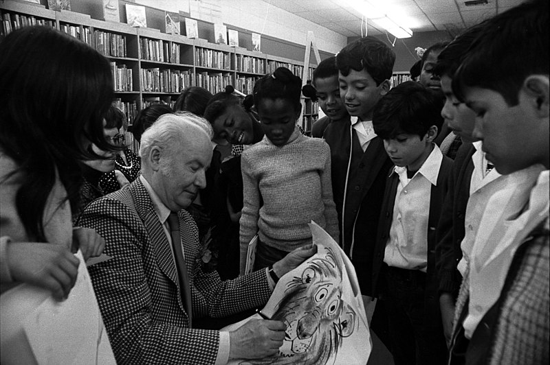 File:Bill Peet signing autographs.jpg