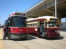 Two TTC streetcar models used in the 20th century. The CLRV model to the left entered service in 1979, eventually replacing the PCC model next to it. CLRV 4152 and PCC 4500.jpg