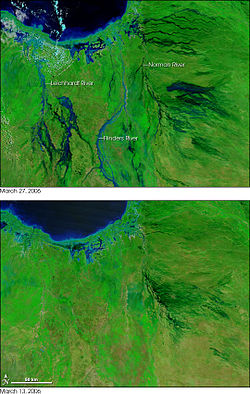 False-color image showing the extent of flooding in the area around Normanton and Karumba, Queensland. Green indicates vegetation and blue indicates water. The top image is two weeks after the bottom. CycloneLarryFlooding MODIS 20060327.jpg