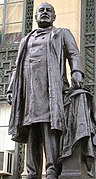 Statue of the former Mayor of Buffalo and later 22nd and 24th President, Grover Cleveland on northeast corner of the building.