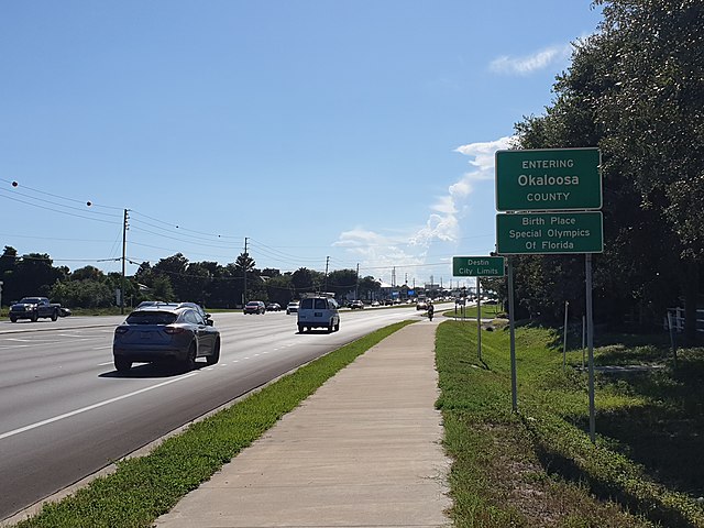 Several road signs at the county and Destin boundary.