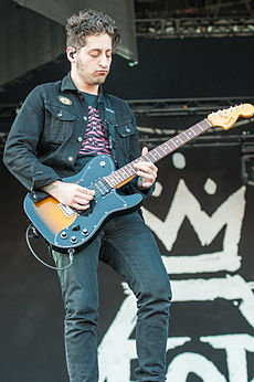 Trohman performing with Fall Out Boy in 2014