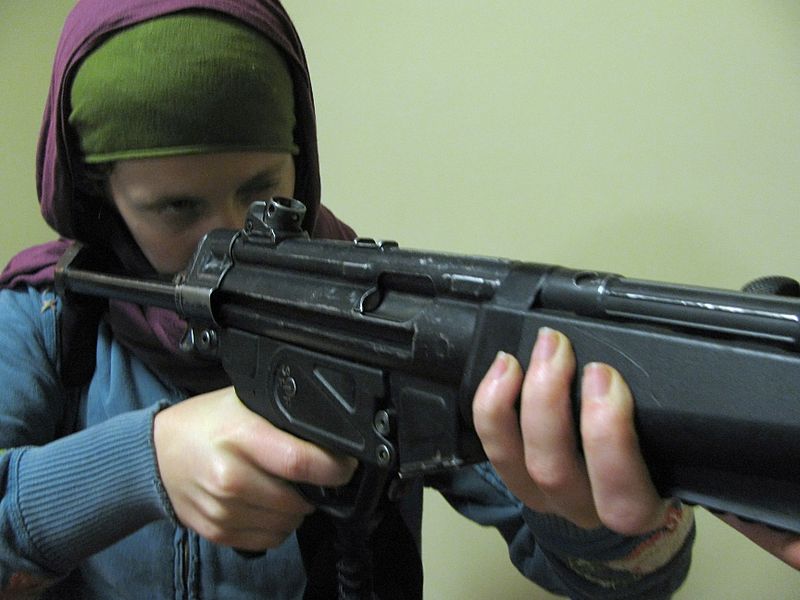 File:For their own safety foreign aid workers in Afghanistan become familiar with weapons.jpg