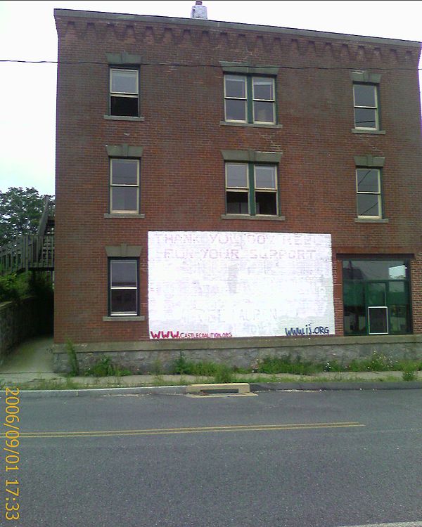 One of the few remaining houses in the Fort Trumbull neighborhood, September 1, 2006. Underneath the white paint can just barely be read the words "Th