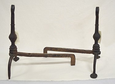 A pair of simple wrought iron andirons, 1780s, America Hand-wrought Metal Andiron Set.jpg