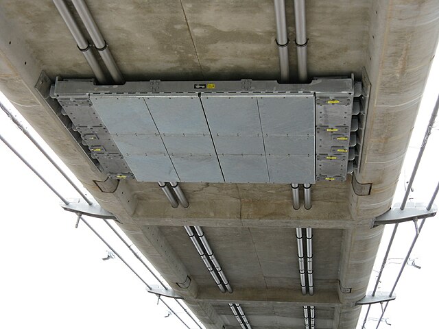 Single-tuned mass damper fitted to the underside of the concrete decking of the smaller arch of the bridge.