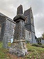 Irbic Cross, St Dochdwy's Church, Llandough with the steeple behind.jpg