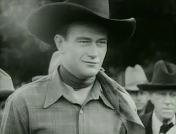 Wayne as "Singin' Sandy" in Riders of Destiny (1933)