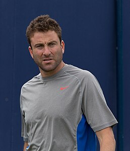 Michael Sell coaching John Isner during practice at the Queens Club Aegon Championships in London, England.