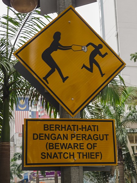 File:Kuala Lumpur Malaysia Beware-of-snatch-thief-sign-01.jpg