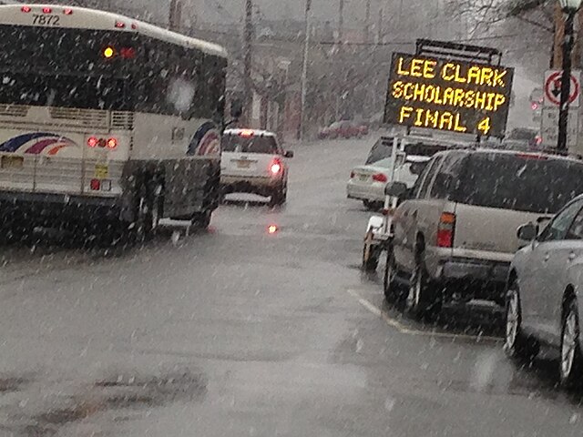 Sign along Broad Avenue for an annual scholarship dinner held in honor of former basketball coach Lee Clark.