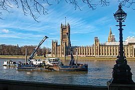 London Titan working opposite the Houses of Parliament