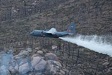 A MAFFS II-equipped C-130 Hercules from the 302nd Airlift Wing drop potable water over Hayman Fire burn scar during their annual aerial wildland firefighting training and certification with the U.S. Department of Agriculture Forest Service, May 13, 2021, Pike-San Isabel National Forest, Colorado. MAFFS II 302nd Airlift Wing Drops Potable Water.jpg