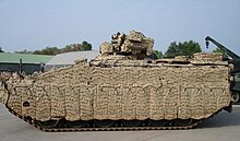 A "multi-spectral" camouflage system" fitted to a Marder armoured vehicle reduces visual, infrared and radar "signatures", and permits movement Marder 1A5 Mobile Camouflage System Barracuda.jpg