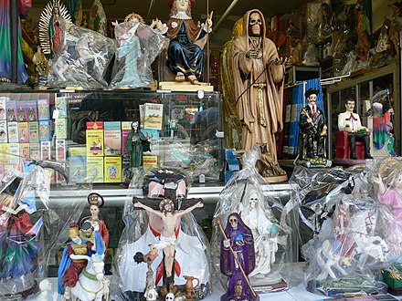 Santa Muerte statues alongside other items of Mexican veneration (Jesus, Mary) on sale at a shop on Broadway in downtown Los Angeles.
