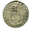 Reverso de moneda de 8 reales (plata) de 1740 resellada en Mozambique.
