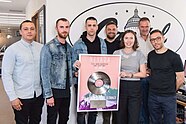 Nevada (third from the left) with his plaque for The Mack at Capitol Records UK Nevada (musician) 2.jpg