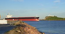 Bulk carrier Nicole entering Newcastle Harbour in August 2007 Newcastle - Bulk carrier passing Nobbys.jpg