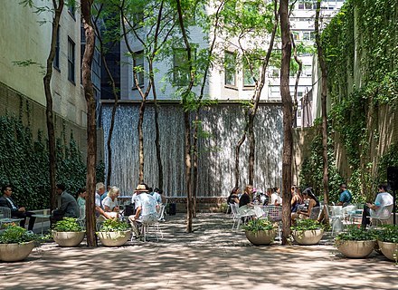 Paley Park in Midtown Manhattan, New York City, opened in 1967 as one of the earliest pocket parks and privately owned public spaces in the United States.
