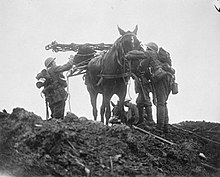 Hugh Lofting's pacifism, a major theme in the poem Victory for the Slain, grew from his experiences in World War I where horses, like the one pictured here, had no way to defend themselves. Q 005717HoreseInGasMaskPilckemRidge31October1917.jpg