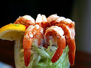 Shrimp cocktail lemons lettuce seafood.jpg